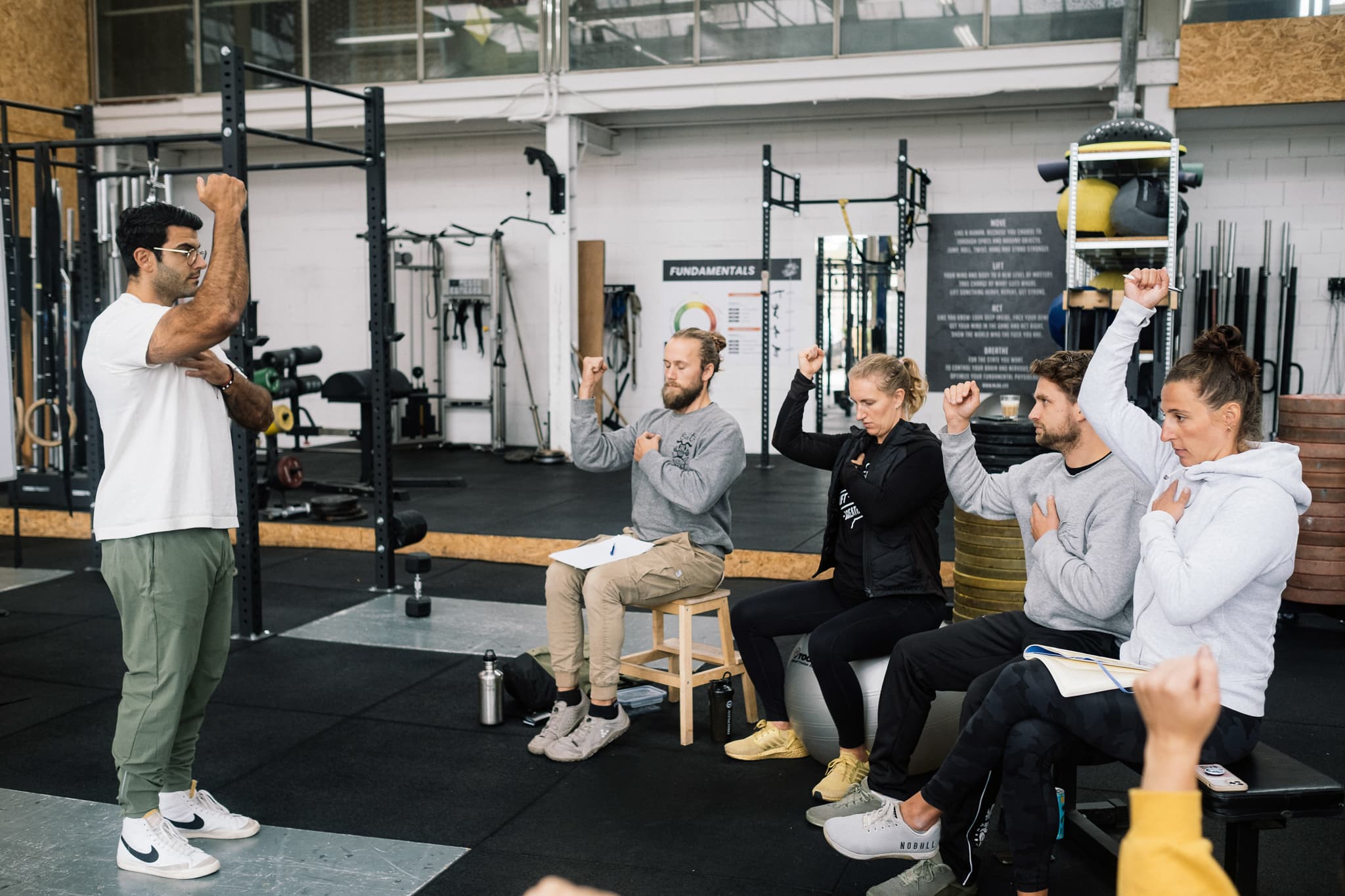 Coaches practicing the Moved framework in a seminar setting