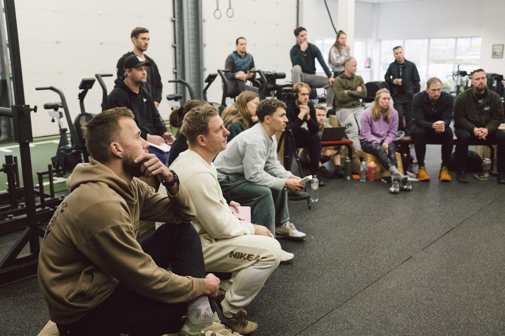 Coaches listening during a Moved Academy teaching session