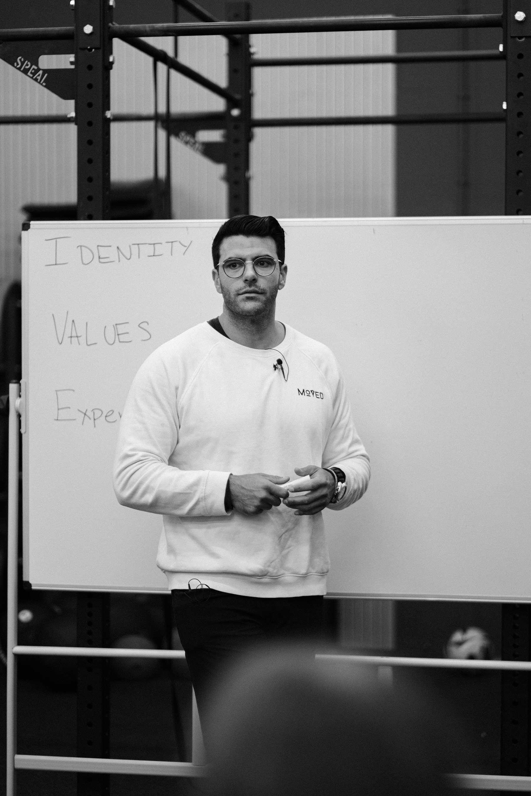 Richard Aceves teaching Moved Academy philosophy at the whiteboard