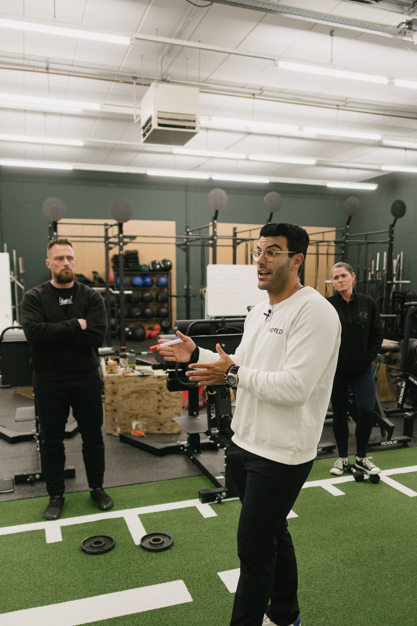 Richard Aceves teaching assessment concepts to coaches at a Moved Academy seminar